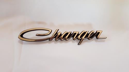 69 Dodge Charger Headlamp Door Emblem N.O.S (FREE SHIPPING)